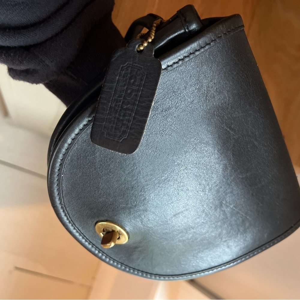 Coach Black Leather Crossbody Bag with brass accents. Mini bag